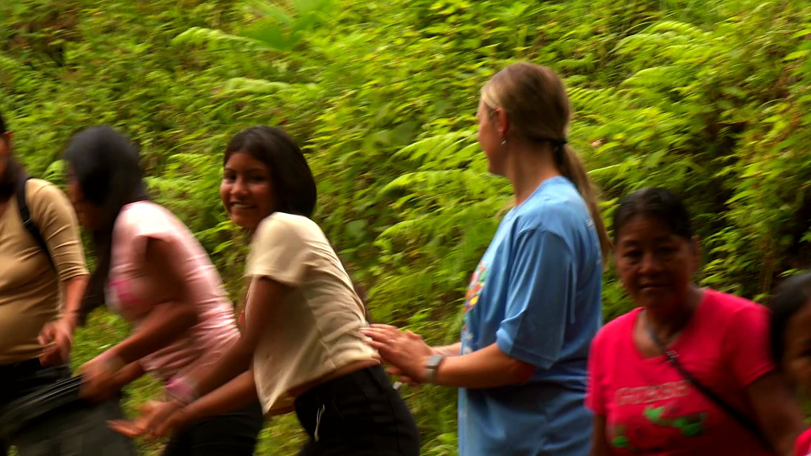 Villagers and Guild volunteers passing buckets up a hillside