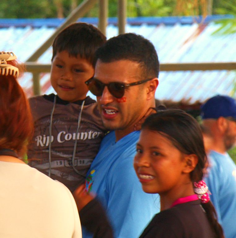 A Guild volunteer with village children