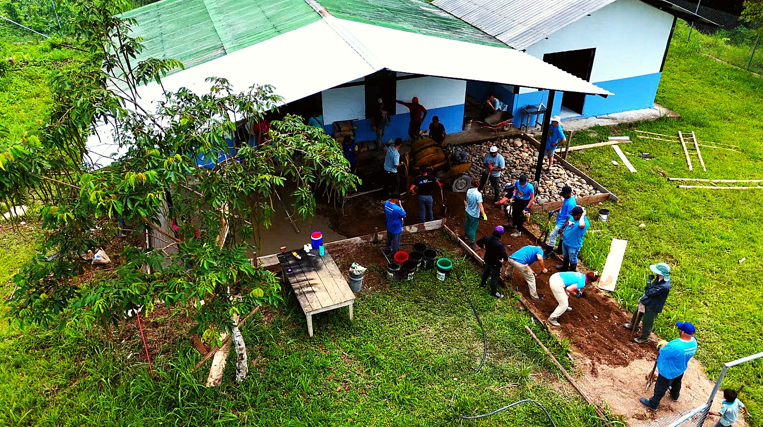 Volunteers laying the foundation beside the medical center